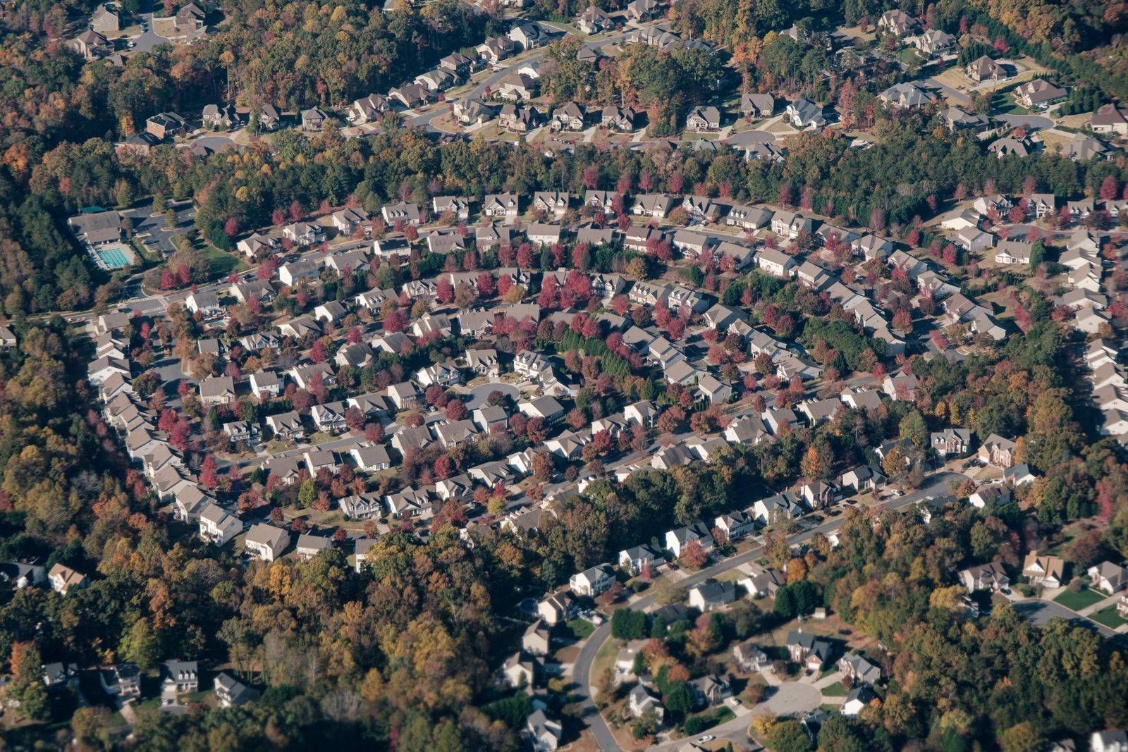 Aerial view of a fall-colored new-build subdivision in the Charlotte metro area