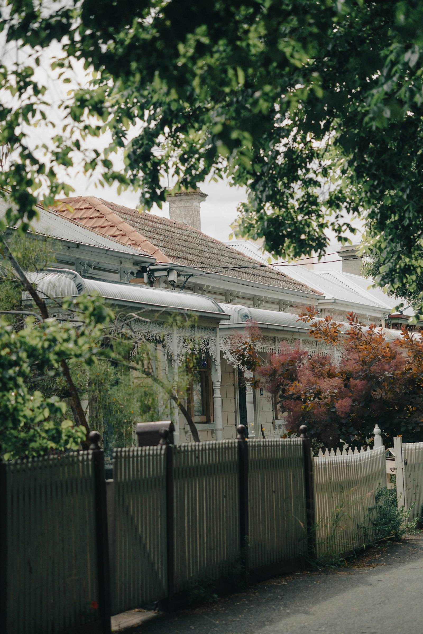 A Melbourne terrace house with ornate iron lacework on the verandah